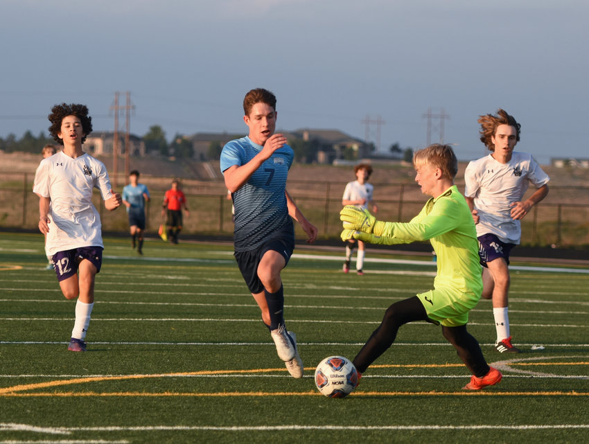Mountain View goalkeeper Dannon Littell gets in front of a kick by Riverdale Ridge's Logan Nicoll (7), during first half action at Riverdale Ridge Sept. 22.